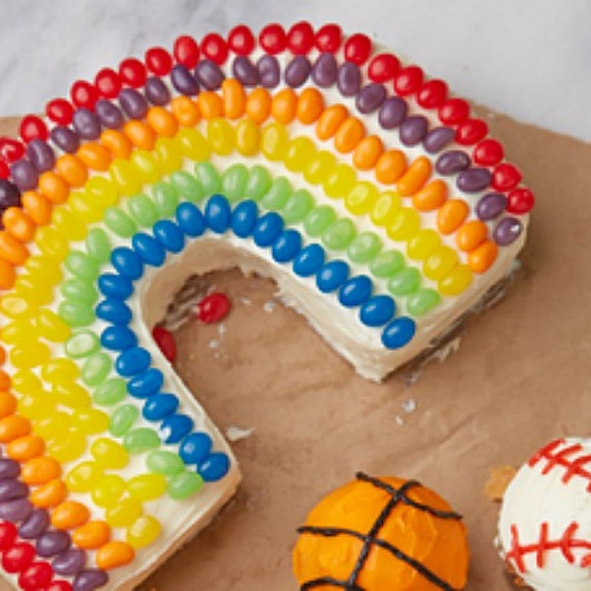 Rainbow on sale shaped cake