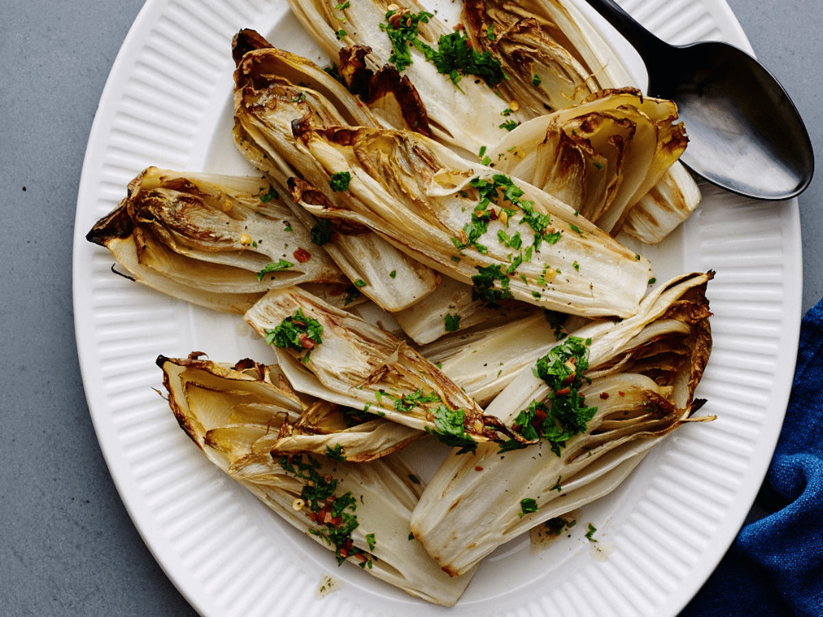 https://jamiegeller.com/.image/ar_4:3%2Cc_fill%2Ccs_srgb%2Cq_auto:good%2Cw_1200/MTY4NjA1MDIwOTk5MTMyOTUw/roasted-endive-with-fish-sauce-vinaigrette.png