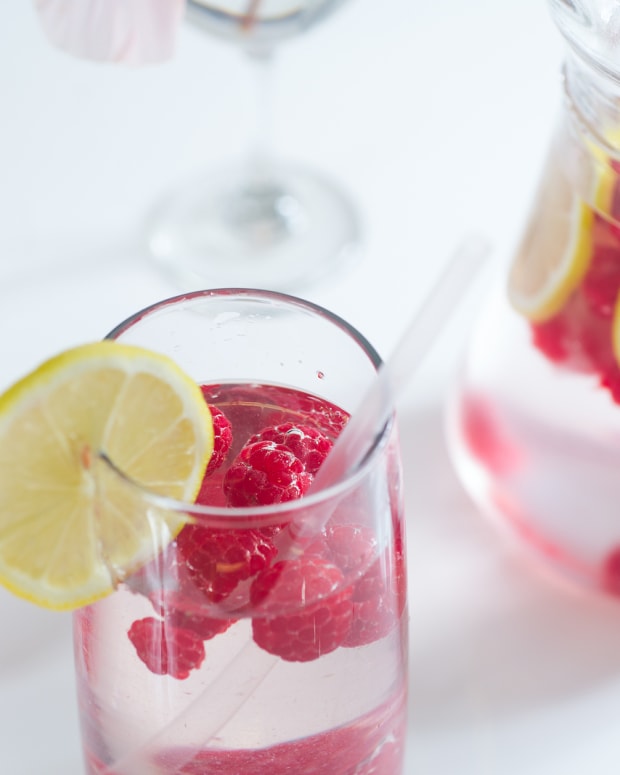 Fresh lemonade with raspberry ice cubes