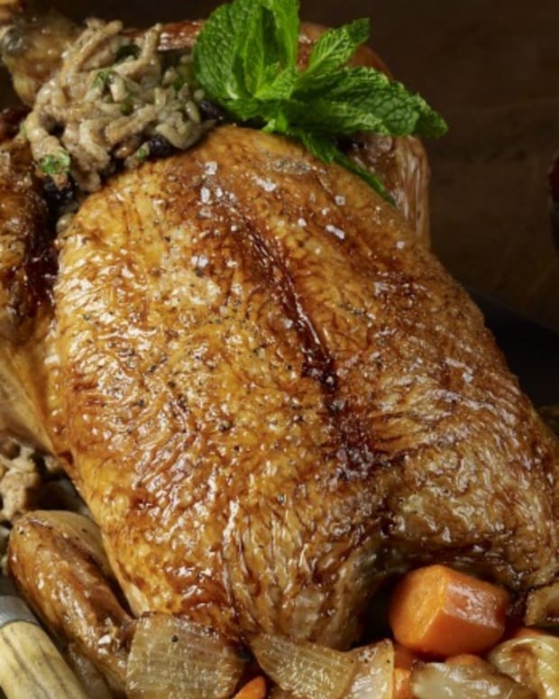 Middle Eastern Roasted Chicken with Rice, Currant, and Pine Nut Stuffing