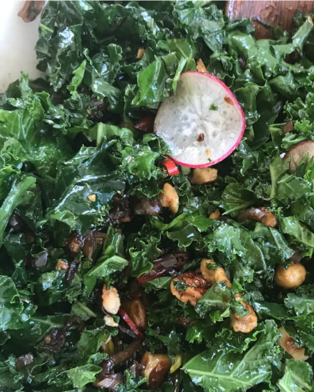 Kale Salad with Warm Shallot Vinaigrette and Crunchy Nut Topping