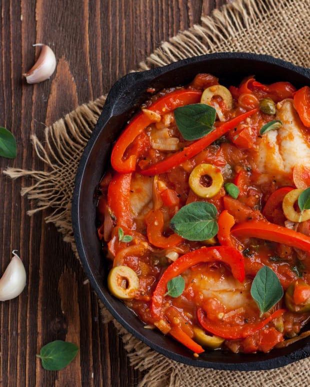 white fish with peppers and onions