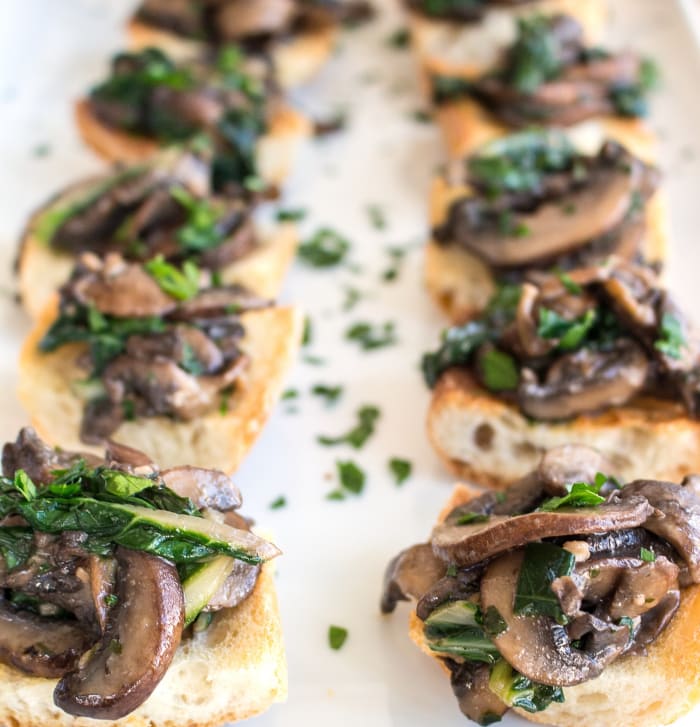 Wilted Greens and Sautéed Mushroom Crostini - Jamie Geller