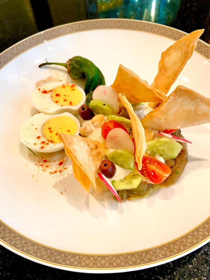 Sabich Salad smoked eggplant, tahini cream, hard- boiled egg, tomatoes, cucumber, chickpeas, harissa, crispy taboon bread