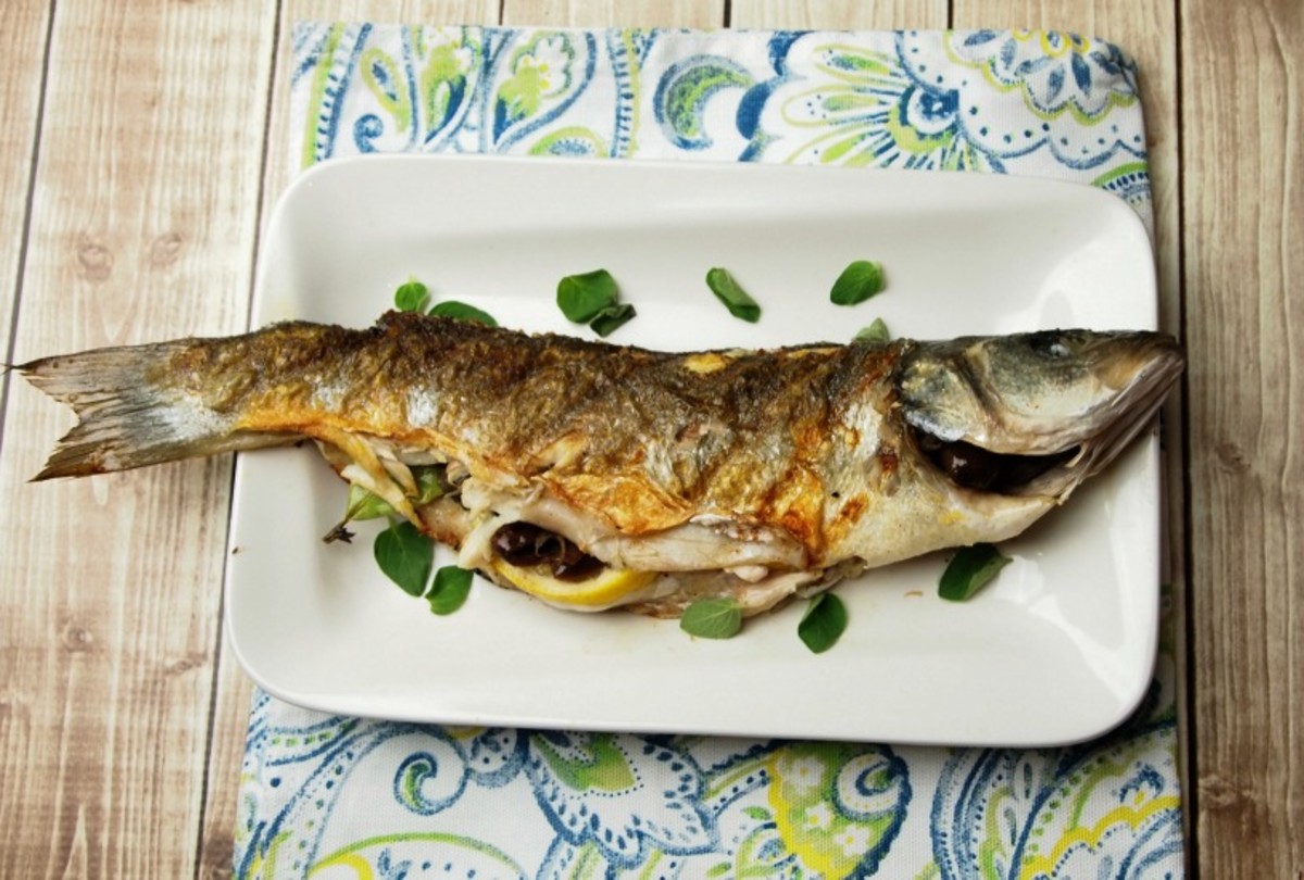 whole grilled branzino with olives and lemon