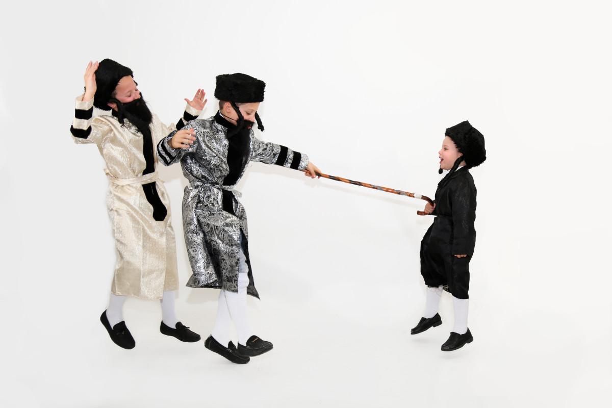 3 Boys Dressed as Chasidim Dancing with a Cane