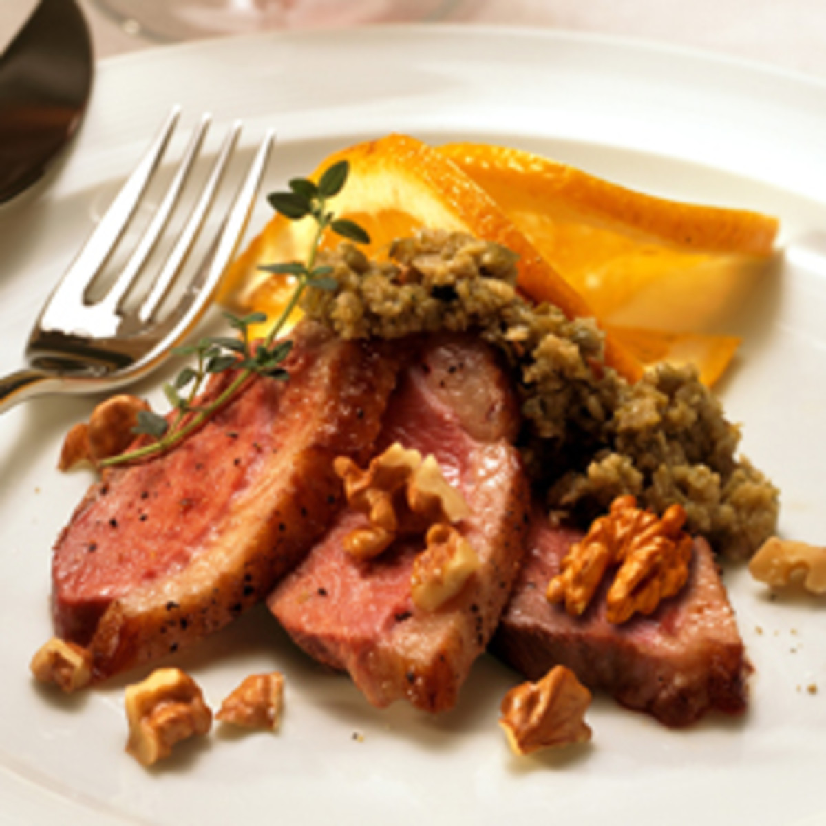 Charlie Palmer’s Seared Duck with Roasted Walnuts and Green Olive Tapenade