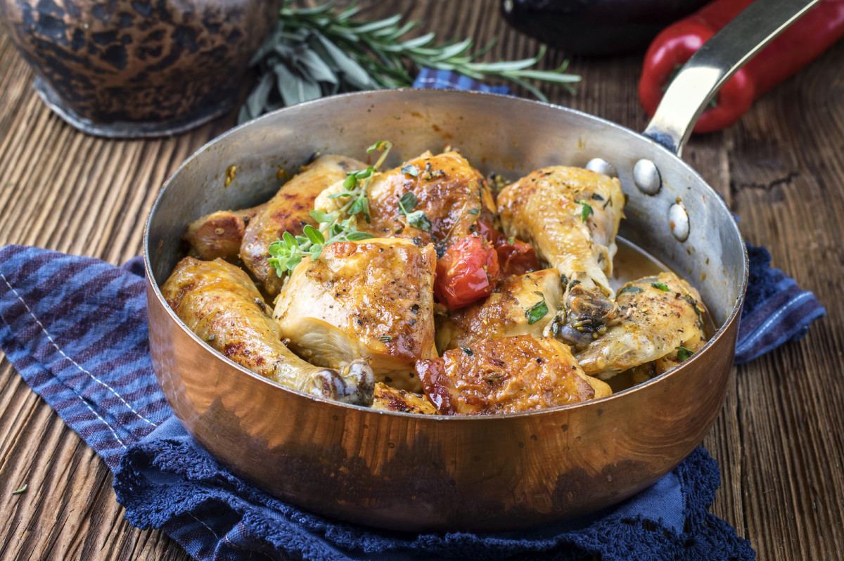 Chicken in the pot with fresh herbs