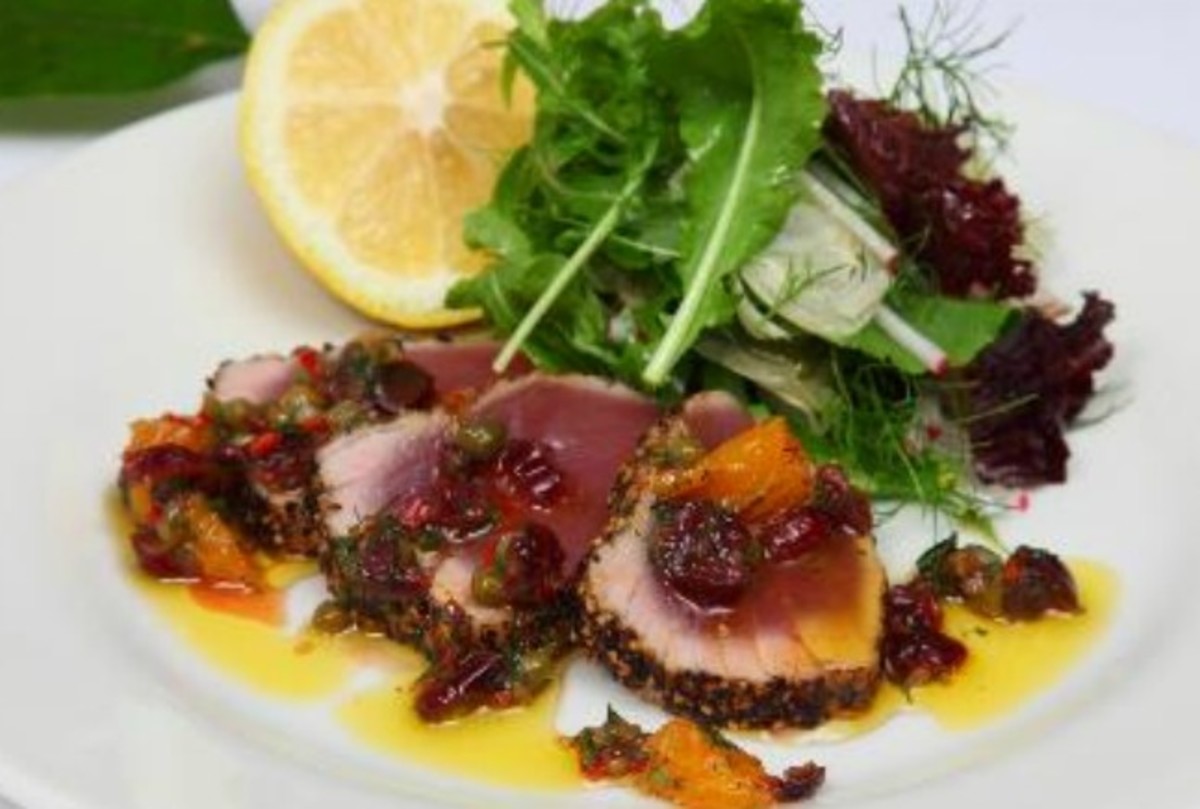 Seared peppered yellow fin tuna with dried cranberries, orange, chilli & dill