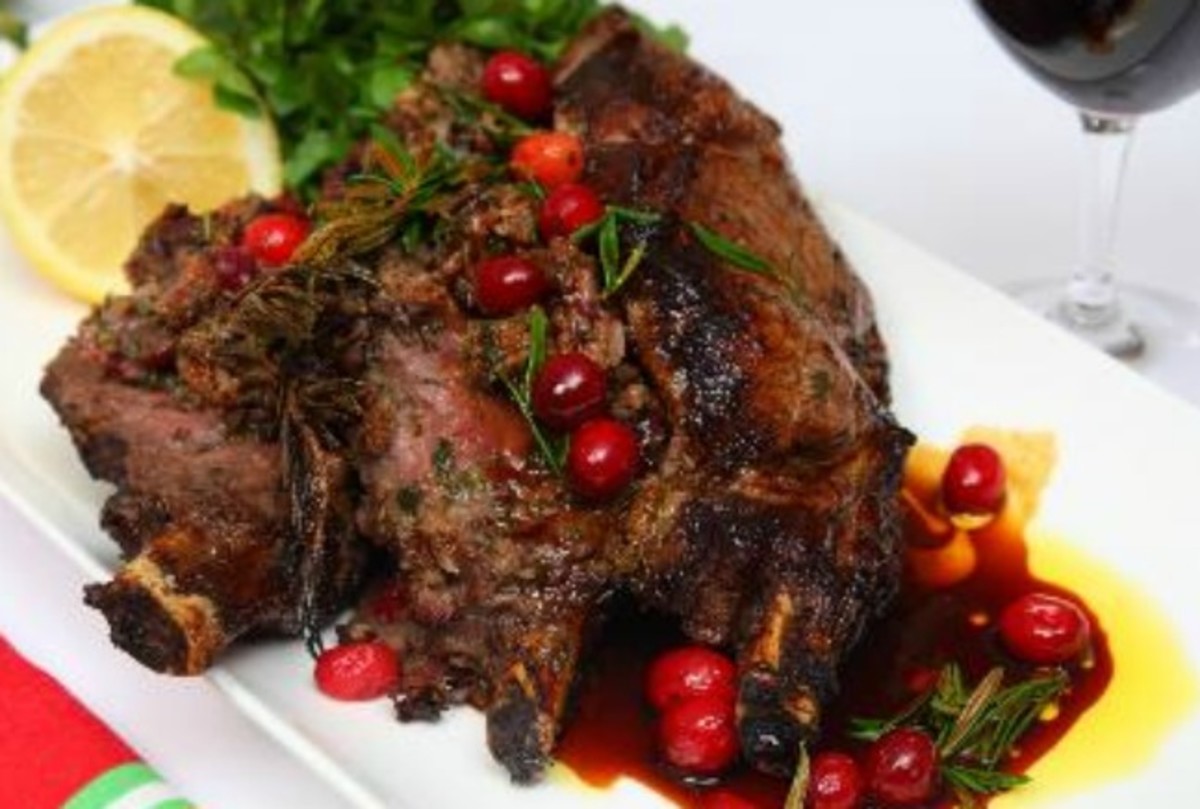 Roasted veal rib eye stuffed with cranberries, dates, sage & rosemary