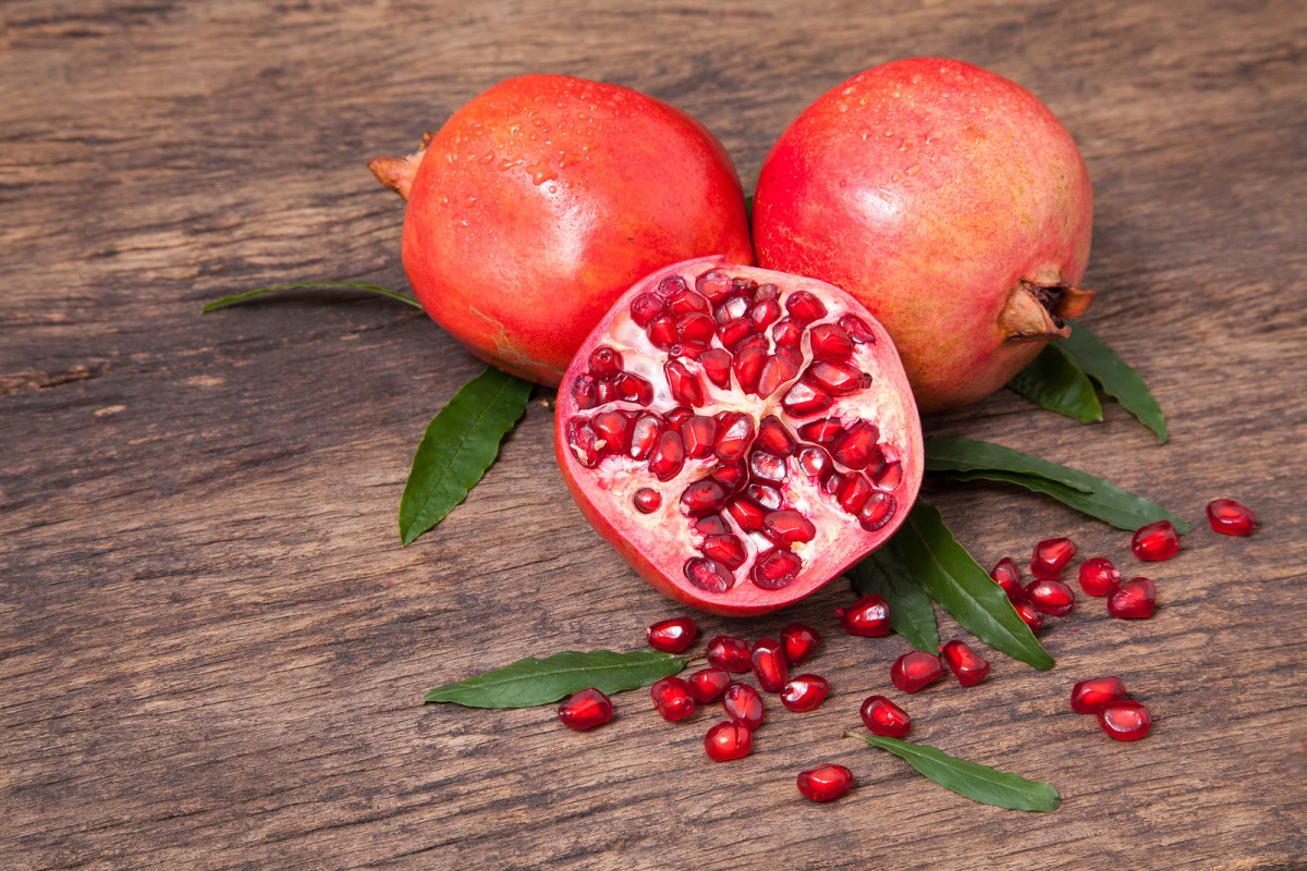 bigstock-Fresh-Pomegranate-Fruit-And-Po-148786013.jpg