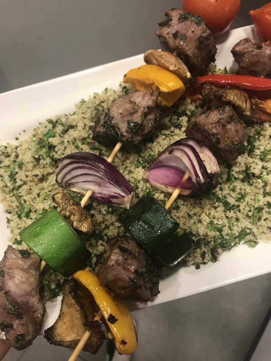Kabobs with green couscous