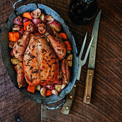 Apple-Stuffed Rosemary Roast Chicken with New Potatoes