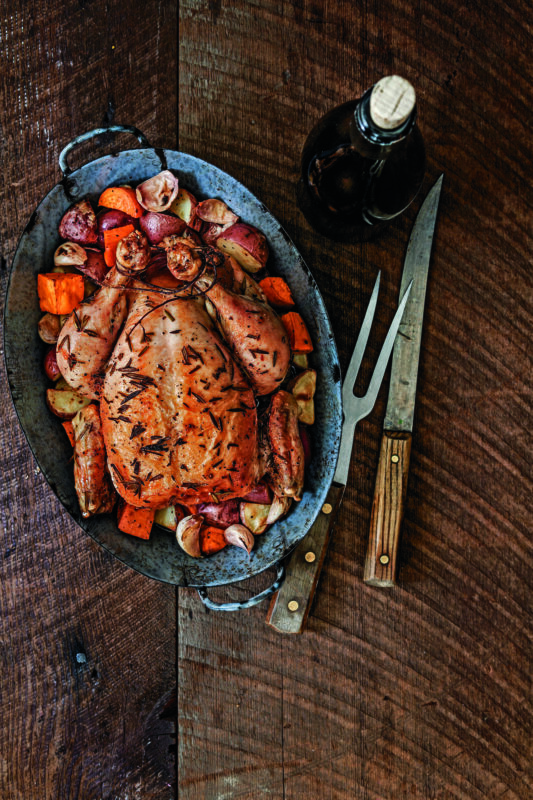 Apple-Stuffed Rosemary Roast Chicken with New Potatoes