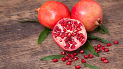 bigstock-Fresh-Pomegranate-Fruit-And-Po-148786013.jpg