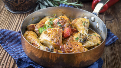 Chicken in the pot with fresh herbs
