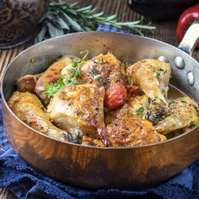 Chicken in the pot with fresh herbs