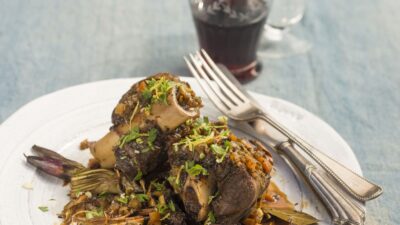 BRAISED LAMB SHANKS WITH CRISPED ARTICHOKES AND GREMOLATA