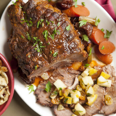 Braised pot roast with prunes, ancho chilis, golden raisins and roasted apples