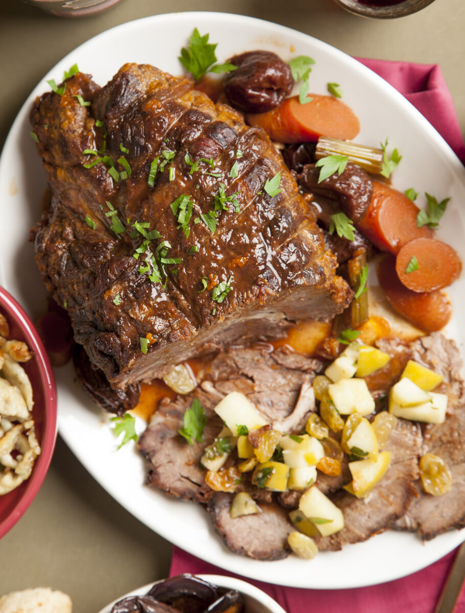 Braised pot roast with prunes, ancho chilis, golden raisins and roasted apples