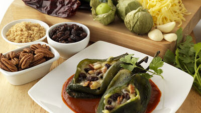 Chile Rellenos with California Raisins, Cheese, Pecans and Guajillo Chile Sauce