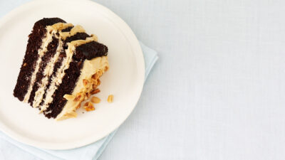 Chocolate Peanut Butter Mousse Cake with Peanut Praline and Caramel Sauce