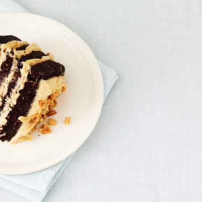 Chocolate Peanut Butter Mousse Cake with Peanut Praline and Caramel Sauce
