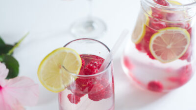 Fresh lemonade with raspberry ice cubes