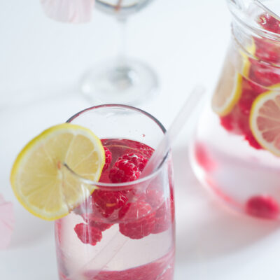 Fresh lemonade with raspberry ice cubes
