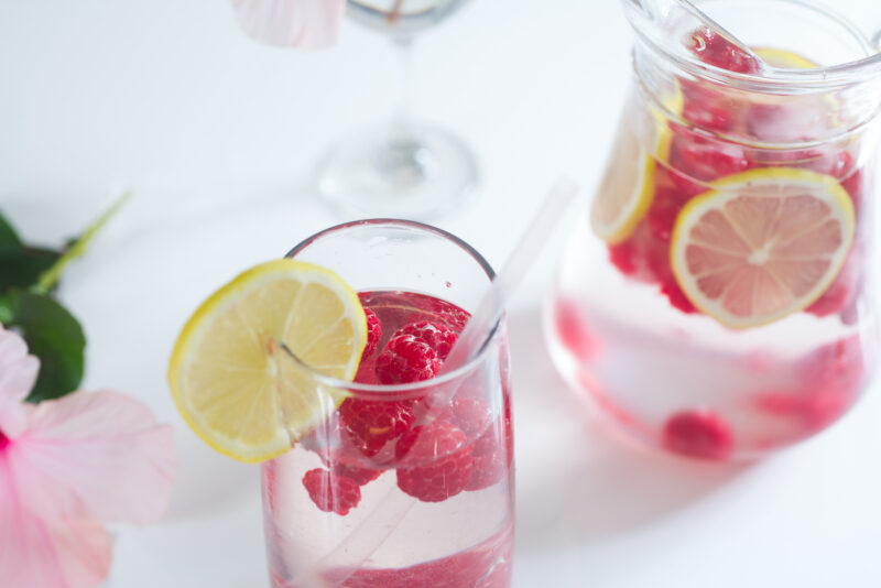 Fresh lemonade with raspberry ice cubes