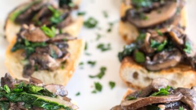 WILTED GREENS AND SAUT&Eacute;ED MUSHROOM CROSTINI