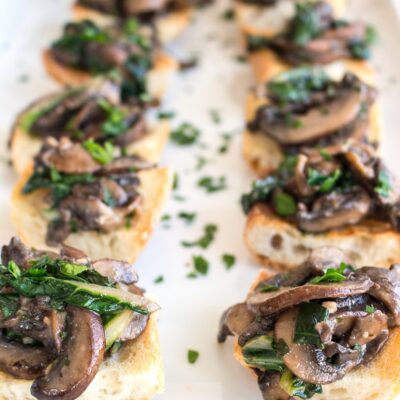 WILTED GREENS AND SAUTÉED MUSHROOM CROSTINI