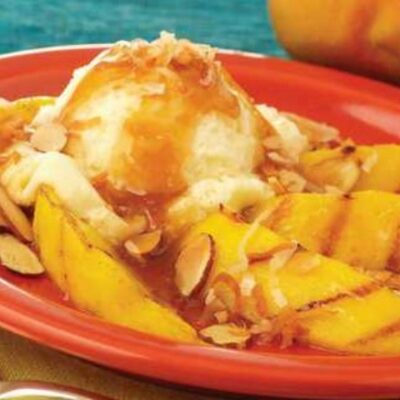 Grilled Mango with Spicy Rum Glaze and Vanilla Ice Cream