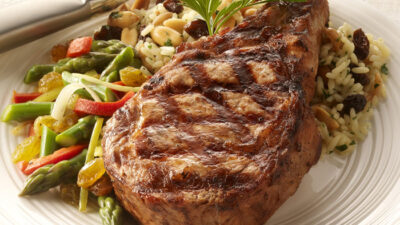 Grilled Veal Chop with Raisin-Rice Pilaf