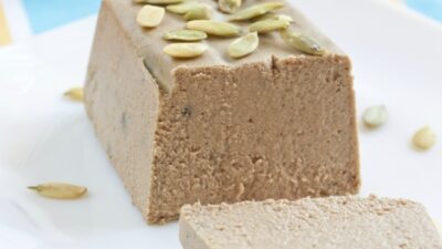 Meat paste made as small loaf with pumpkin seeds