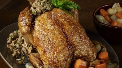 Middle Eastern Roasted Chicken with Rice, Currant, and Pine Nut Stuffing