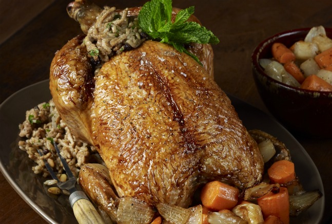 Middle Eastern Roasted Chicken with Rice, Currant, and Pine Nut Stuffing