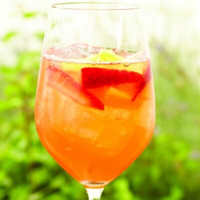 Sangria with strawberry tequila, fresh pineapple juice, and dry rose wine