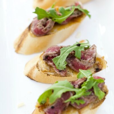 ROASTED GARLIC RIB EYE CROSTINI