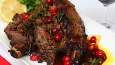 Roasted veal rib eye stuffed with cranberries, dates, sage & rosemary