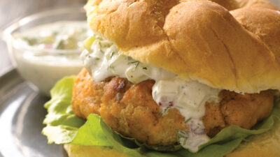 salmon burger patty with a cucumber dill sauce
