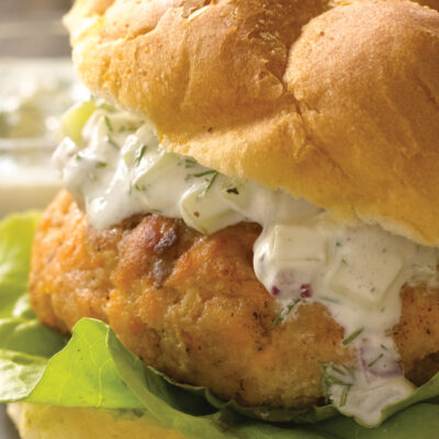 salmon burger patty with a cucumber dill sauce