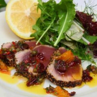 Seared peppered yellow fin tuna with dried cranberries, orange, chilli & dill