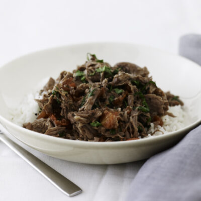 Shredded Lamb with Tomato and Basil over Rice