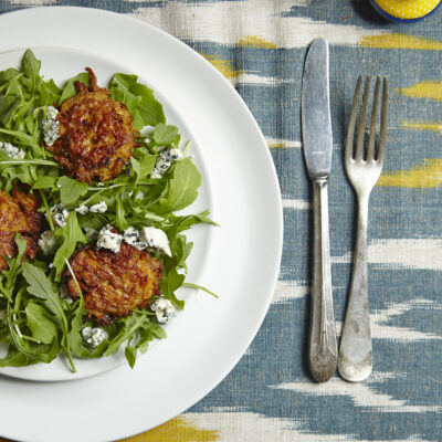 SWEET POTATO LATKE, ARUGULA, AND BLUE CHEESE SALAD WITH HONEY VINAIGRETTE