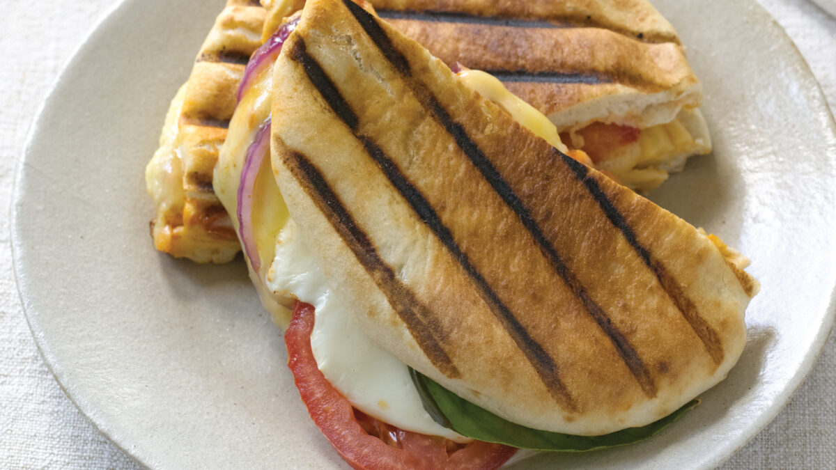 three cheese pita panini with basil, red onion and tomatoes