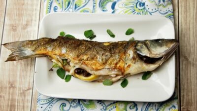 whole grilled branzino with olives and lemon
