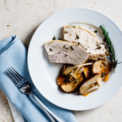 ROASTED SAGE AND ROSEMARY TURKEY WITH SWEET POTATOES AND APPLES