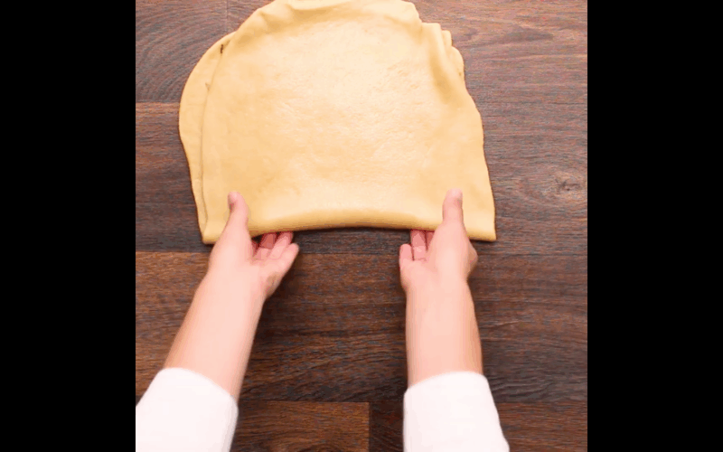 Folding up the dough. Going to roll this into another rectangle then spread the second layer of chocolate.