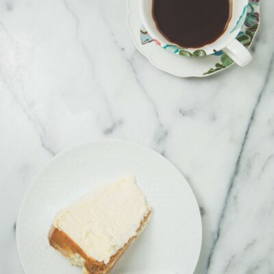 Slice of cheesecake with coffee